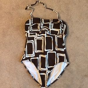 One piece swimsuit with removable strap.
